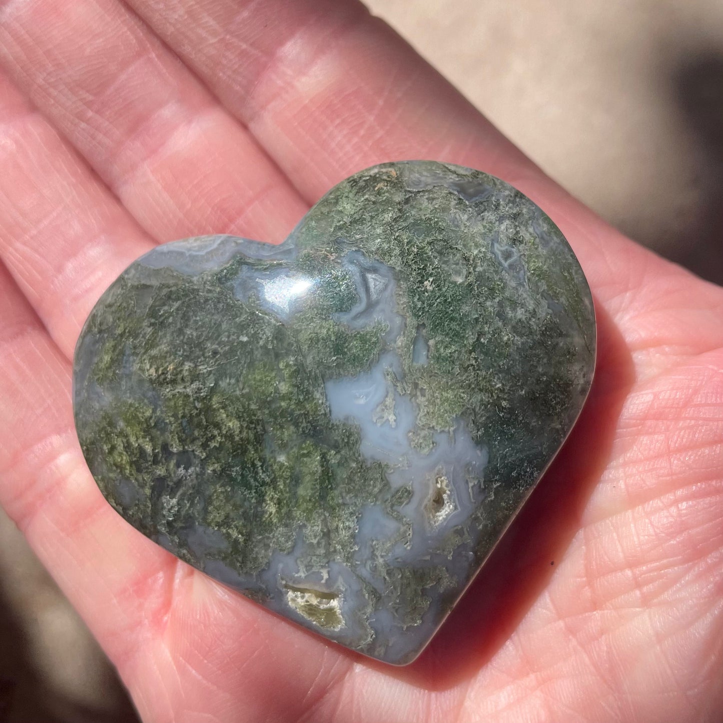 Moss Agate Heart in palm of hand