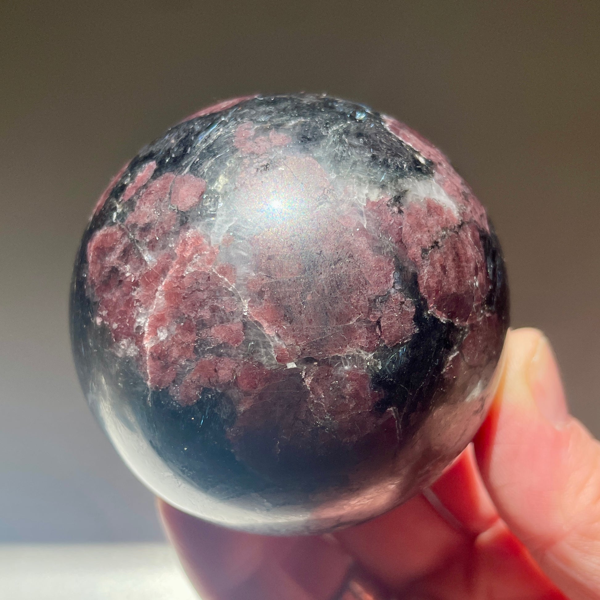 Garnet + Arfvedsonite sphere 6CM