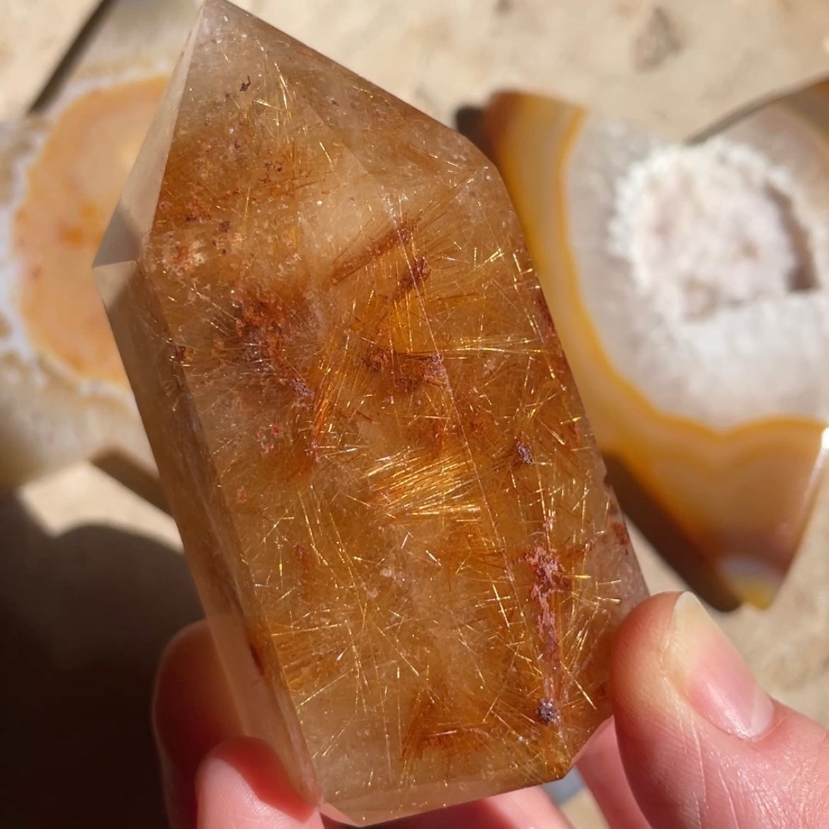 Golden rutile tower with red inclusions 
