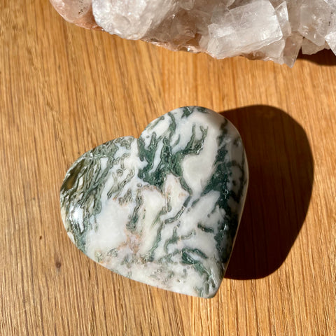 Moss Agate Heart on wooden background