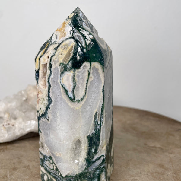 Moss Agate Tower standing on stone bench