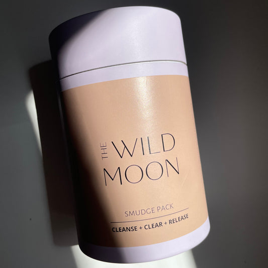 The Wild Moon Smudge Pack lying on a white bench.