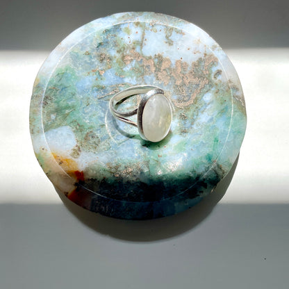 Ring sitting in Moss Agate trinket 
