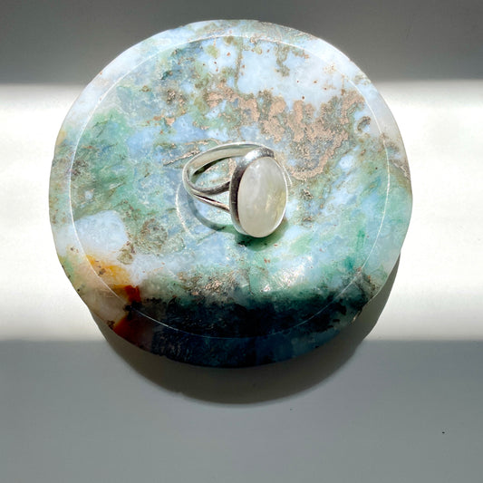 Ring sitting in Moss Agate trinket 