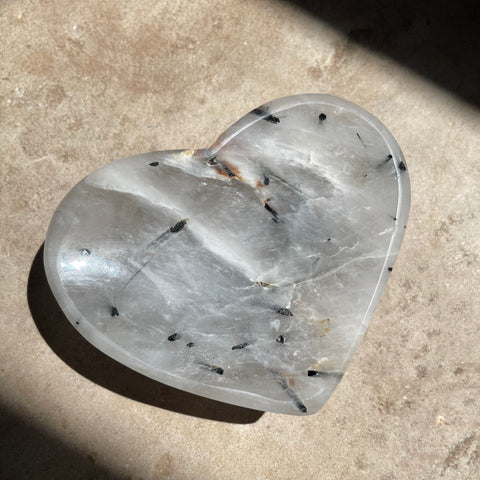 Tourmaline Quartz Heart Bowl 8cm on stone background
